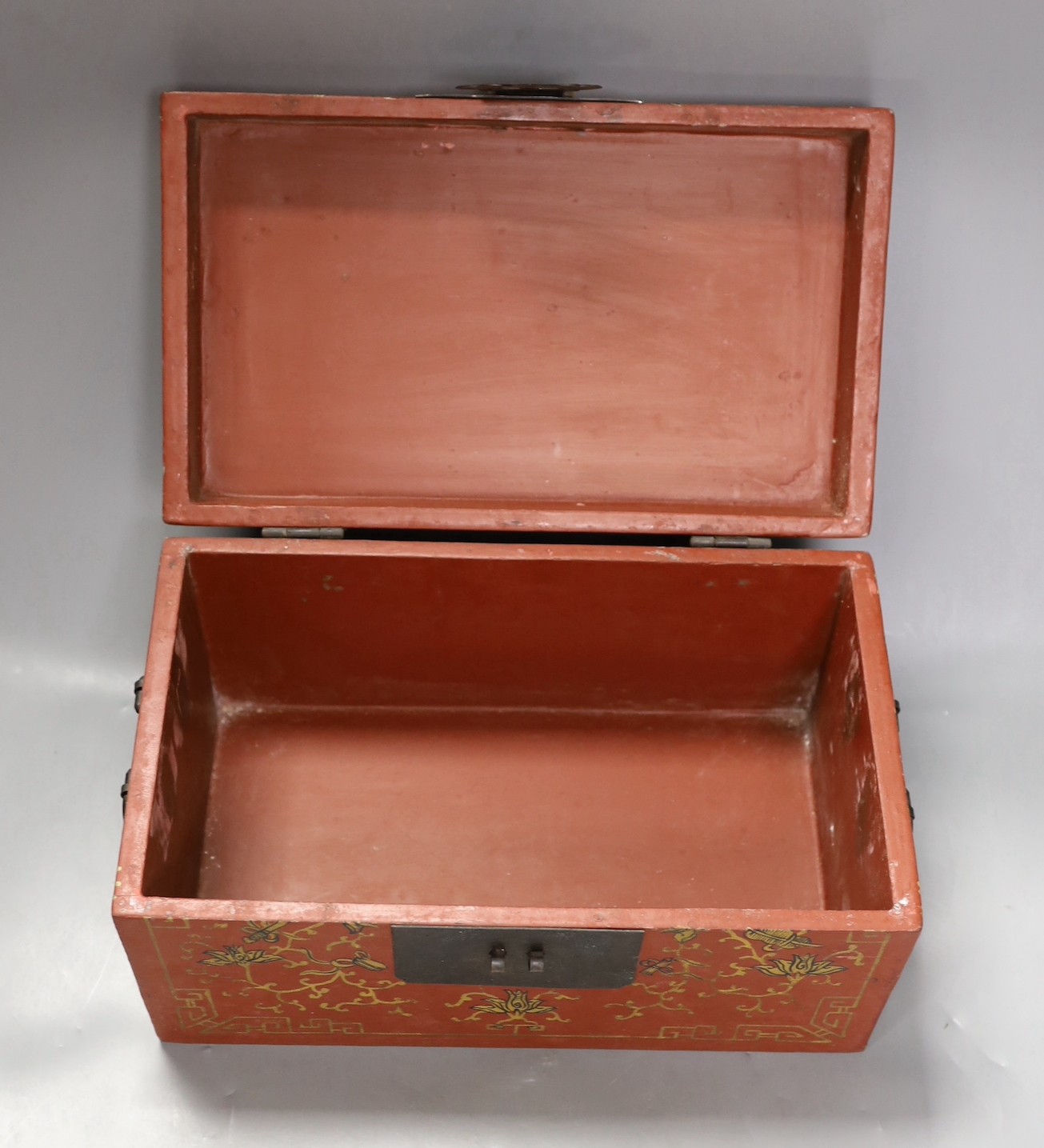 A Chinese lacquered wood Budai carving, 34 cm wide, and a Chinese lacquered wood box (2)